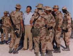 Vice President Dan Quayel speaking with troops in the desert